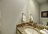 Bathroom with granite sink tops