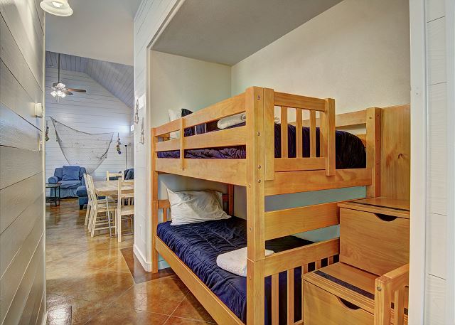 Twin bunk beds in hallway