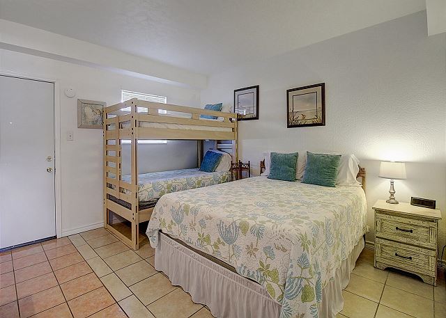 queen bed with bunk room