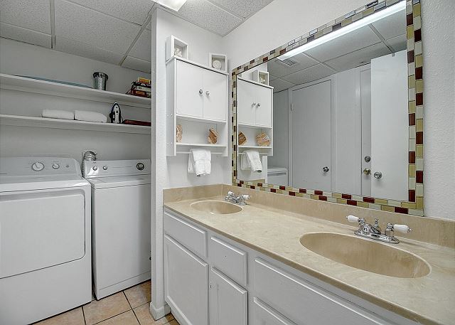 bathroom with laundry area