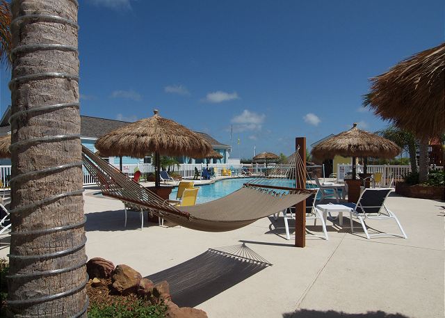 Relax in the hammock or under the cabanas by the pool