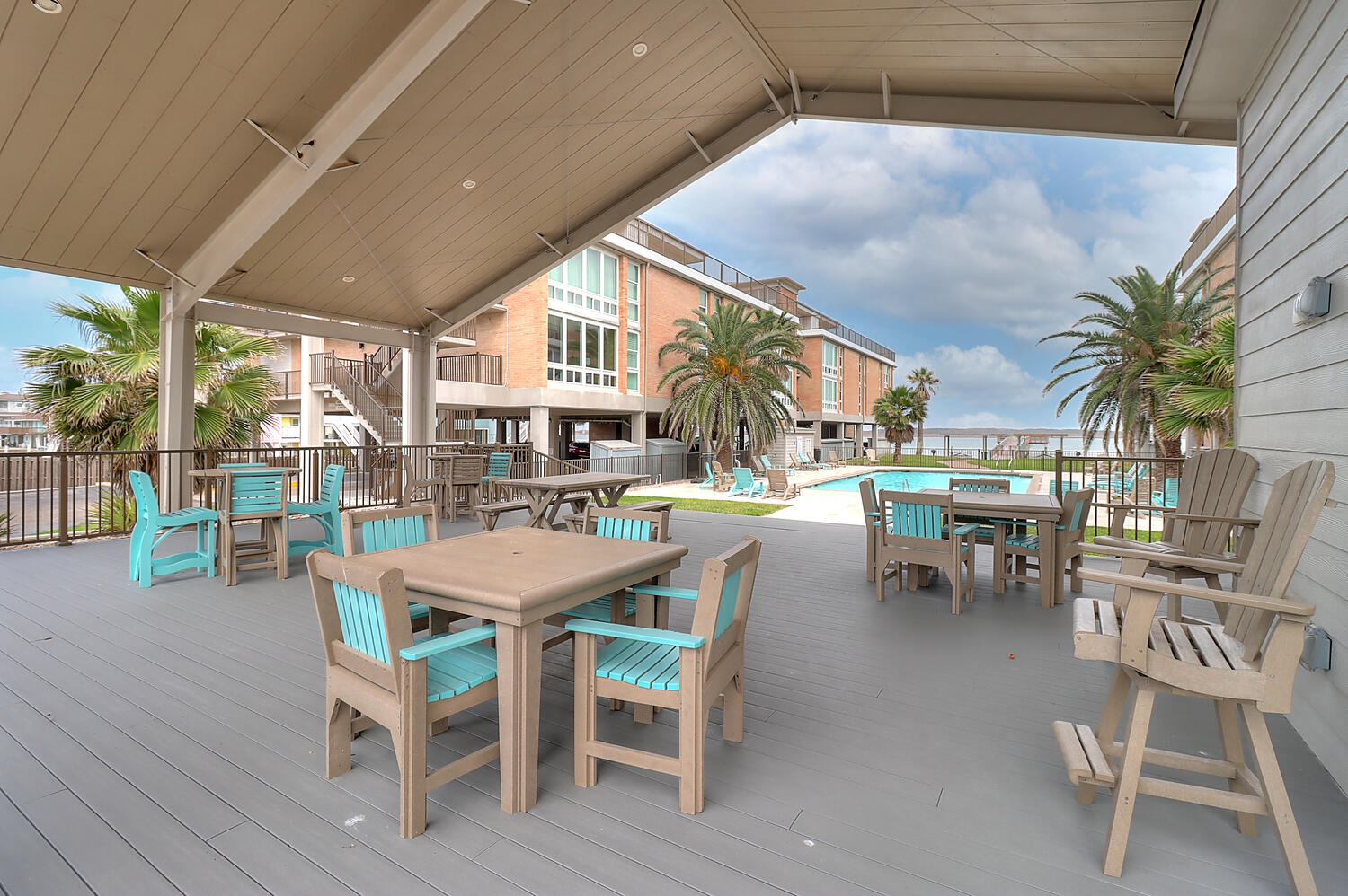 Poolside Perks: Shaded Patio, Seating and a Restroom just steps away! 