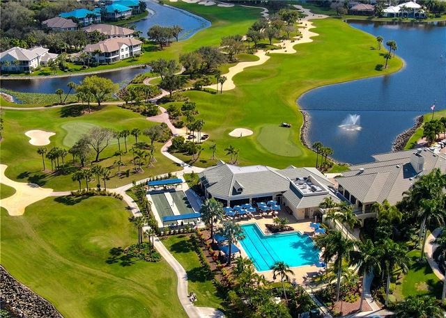 Aerial view of the Stoneybrook clubhouse with pool and golf course