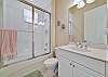 A shower-tub combo in the guest bathroom