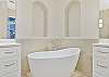 New remodeled primary bathroom with luxurious freestanding tub and spacious walk-in shower