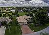 Aerial view of this pool home on the golf course