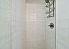 The new remodeled cabana bathroom off the pool deck is equipped with a shower