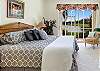 The master suite with gorgeous lake view offers a king sized bed with comfortable Tempurpedic mattress, a smart TV (with local channels only)and access to the screened lanai 