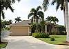 Tropical landscaping surrounds this Florida pool home. Just 2 miles to the beach!