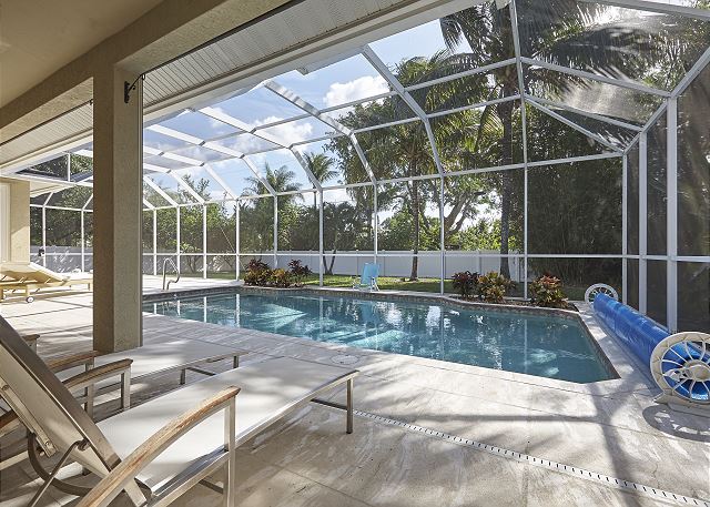 Relax in the private pool or lounge area facing the crystal water and tropical landscaping in your back-yard.