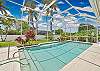 The screened in pool area offers lounge chairs to relax and soak up the sun!