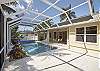 Spacious screened in pool area and covered lanai off the family room and kitchen. 