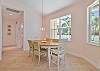 Dining area off the kitchen. Sliding doors opening up to the lanai and pool area.