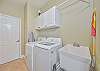Laundry room with sink, washer and dryer