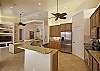 Fully equipped kitchen with stainless steel appliances and granite counter-tops