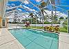 The screened in pool area offers lounge chairs to relax and soak up the sun!