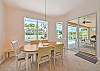 Dining area off the kitchen. Sliding doors opening up to the lanai and pool area.