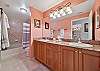 Dual sinks and a shower tub combo in the master bathroom