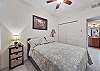 A Queen bed and flat screen TV in the guest bedroom