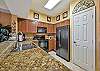 Fully equipped kitchen with granite counter-tops.