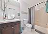 A shower-tub combo in the guest bathroom