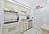 Fully equipped kitchen. Utility closet with washer and dryer