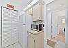 Fully equipped kitchen. Utility closet with washer and dryer