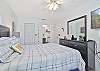 The master bedroom is equipped with a queen size bed and smart TV with cable