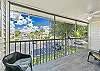 Sliding doors from the living and primary bedroom open up to the oversized screened in balcony.