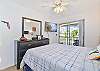 The master bedroom is equipped with a queen size bed and smart TV with cable