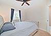 A queen size bed in the guest bedroom.
