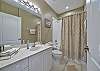 Guest bathroom with a shower-tub combo