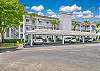 The elevator takes you up to this completely new furnished and decorated top floor condo with amazing lake view! One assigned covered parking spot included