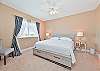 The primary bedroom features a king size bed, flat screen TV and en-suite bathroom. 