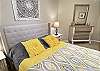 The guest bedroom offers a queen size bed