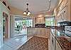 Fully equipped kitchen with sliding doors to the screened in patio