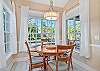 The breakfast nook off the kitchen overlooks the pool area