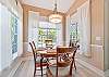 The breakfast nook off the kitchen overlooks the pool area