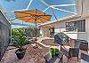 The covered lanai and screened back patio offer complete privacy and are great for lounging and entertaining and feature a BBQ, a dining area, a seating area and lounge chairs! 