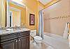 A shower-tub combo in the guest bathroom