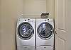 Laundry room off the loft with washer and dryer