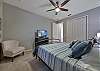 A king size bed and flat screen TV in the guest bedroom. A pocket door can close off the hallway to the guest bedroom and bathroom and make it into a second master suite