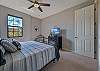 A king size bed and flat screen TV in the guest bedroom. 