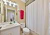 A shower-tub combo in the guest bathroom