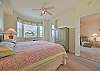 A king size bed and flat screen TV in the master bedroom