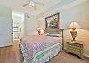 A king size bed and flat screen TV in the master bedroom