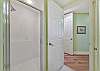 The master bath features double sinks and separate tub and shower.