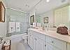 The guest bathroom features a shower/tub combo