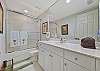 The guest bathroom features a shower/tub combo