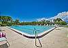 The pool at Vanderbilt Surf Colony offers gorgeous Vanderbilt Channel views